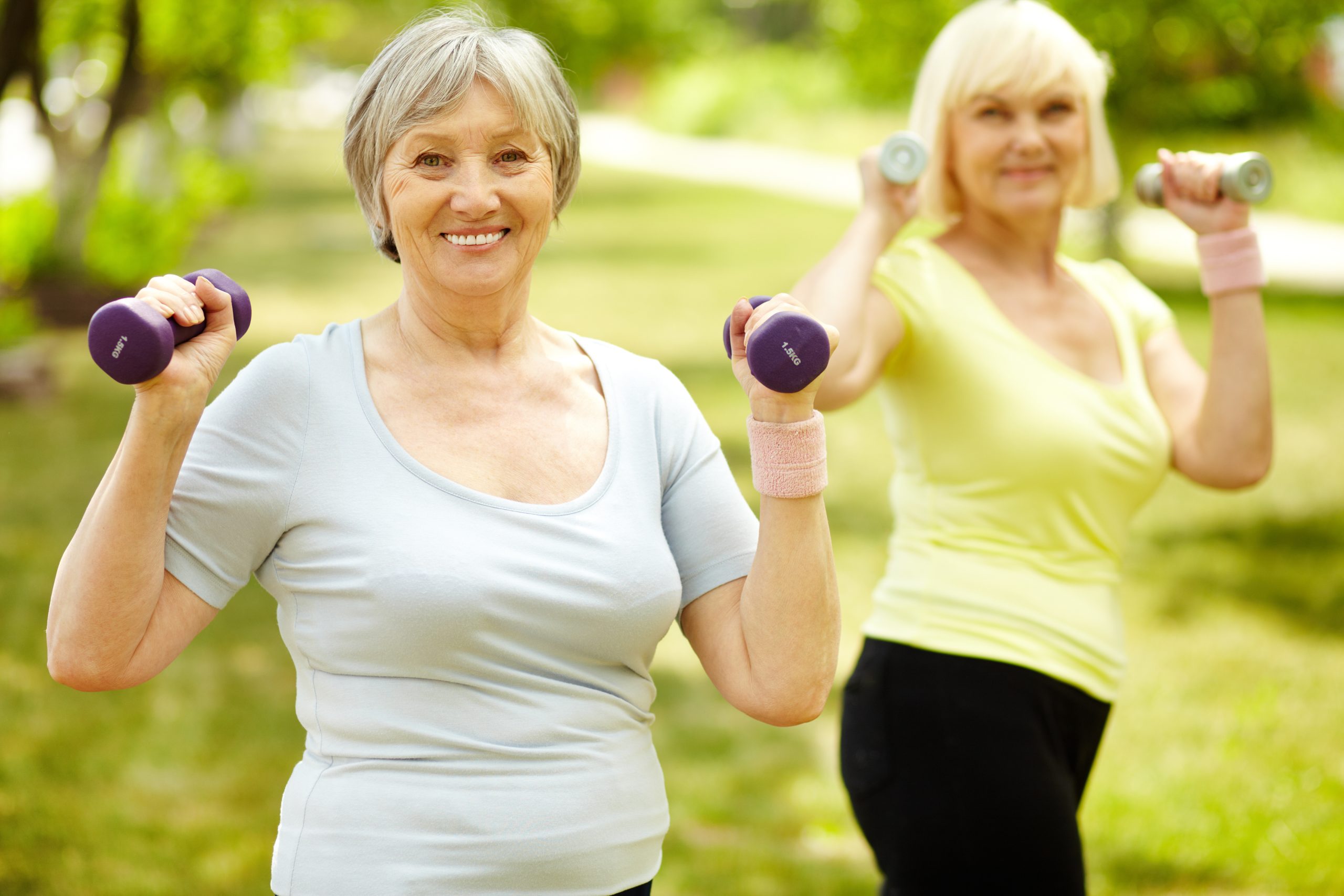 Older women exercising with weights.