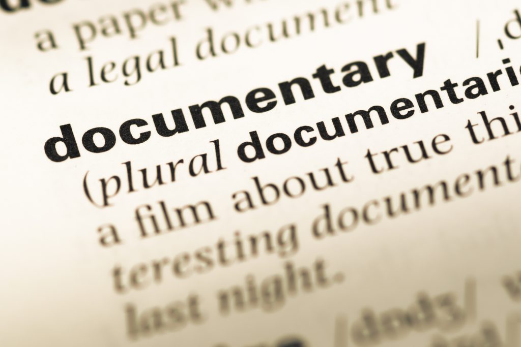 Close up of old English dictionary page with word documentary