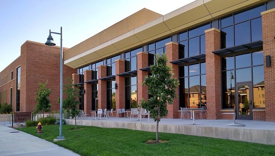 a photo of the exterior brick wall and high windows of the Tomlinson Library at CMU