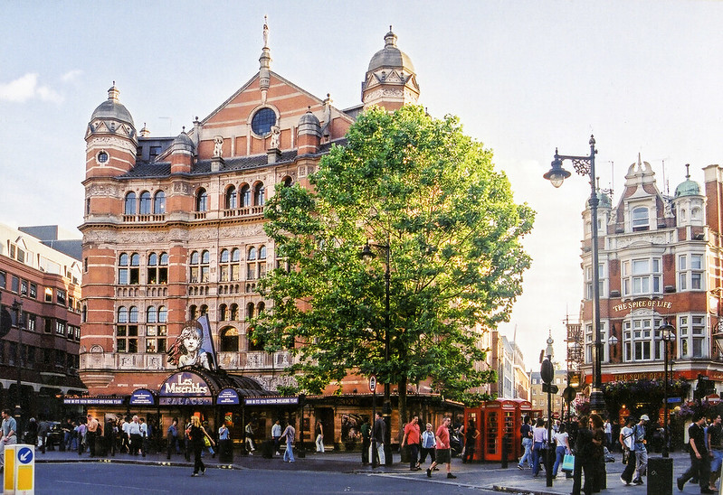 photo of the impressive architecture of the outside of the Palace Theatre, including octagonal towers on the front corners and arched stone windows