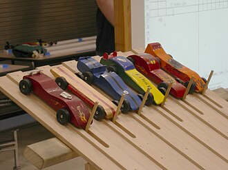 Photograph of cars at the start line in the Pinewood Derby.