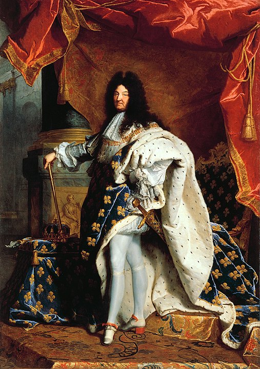 Portrait of Louis XIV standing with a staff and sowrd draped in a garment covered in the flur de lis and lined with fur and wearing white tights with red high heeled shoes.